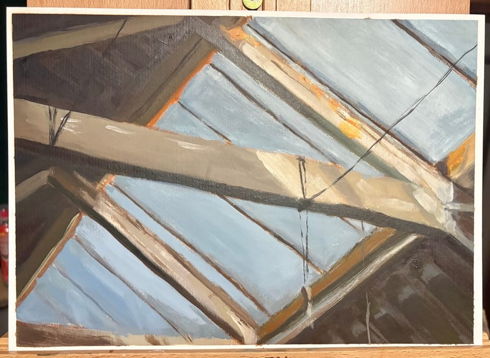 An oil painting cropped close on an easel. The image is of roof beams before an industrial skylight. The viewer is looking up.